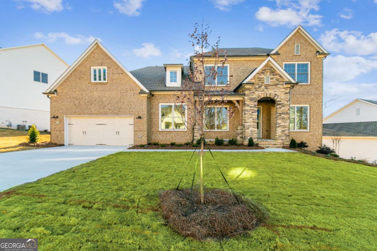 Qualified buyers may be eligible for reduced mortgage payments for the first three years when your home purchase is financed with a mortgage from Presidential Bank Mortgage. See Sales Consultant for details. Home MUST close by October 15th to qualify. Welcome to "The Howell," a stunning home designed for both functionality and elegance. This residence features an expansive daylight basement, perfect for entertaining or creating your dream space. The owner's suite is conveniently located on the main level, providing a private retreat, while the three-car garage and spacious mudroom offer ample storage and convenience for busy lifestyles. Step outside to enjoy the indoor/outdoor patio, seamlessly blending your living space with the scenic backyard, perfect for gatherings or quiet evenings. The gourmet kitchen boasts a butler's pantry that flows into a generous walk-in pantry, making meal prep a breeze. With a flexible space that can adapt to your needs and a separate dining area that effortlessly connects to the kitchen, this home is designed for modern living. Upstairs, you'll find a loft area, ideal for a secondary family room or play area, ensuring everyone has their own space to relax and unwind. Experience the perfect blend of luxury and practicality in "The Howell." This home is eligible for reduced mortgage payments for the first three years when home is financed with preferred lender. Home must close by October 15th with preferred lender.