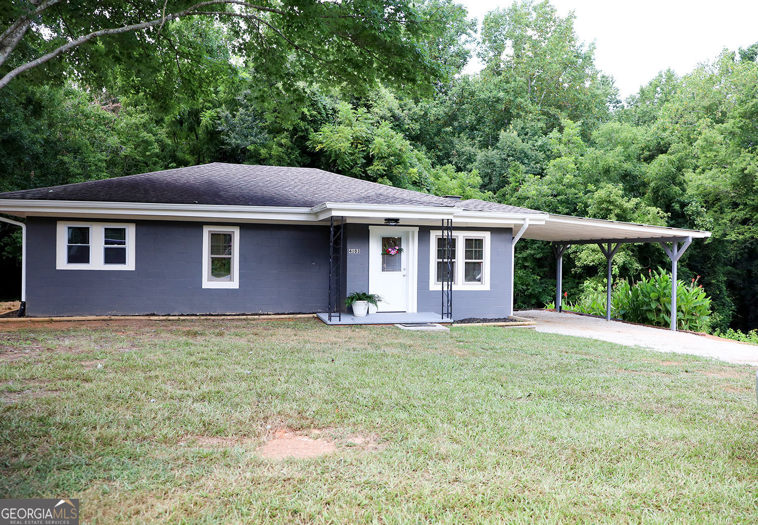 This classic, well built block bungalow has much to offer.It has been newly renovated/updated with new double pane windows, beautiful light fixtures,new dishwasher new heating and air system, new hot water tank as well as a new septic system. There is also a covered back deck and storage building. The location is convenient to downtown Gainesville and 985.