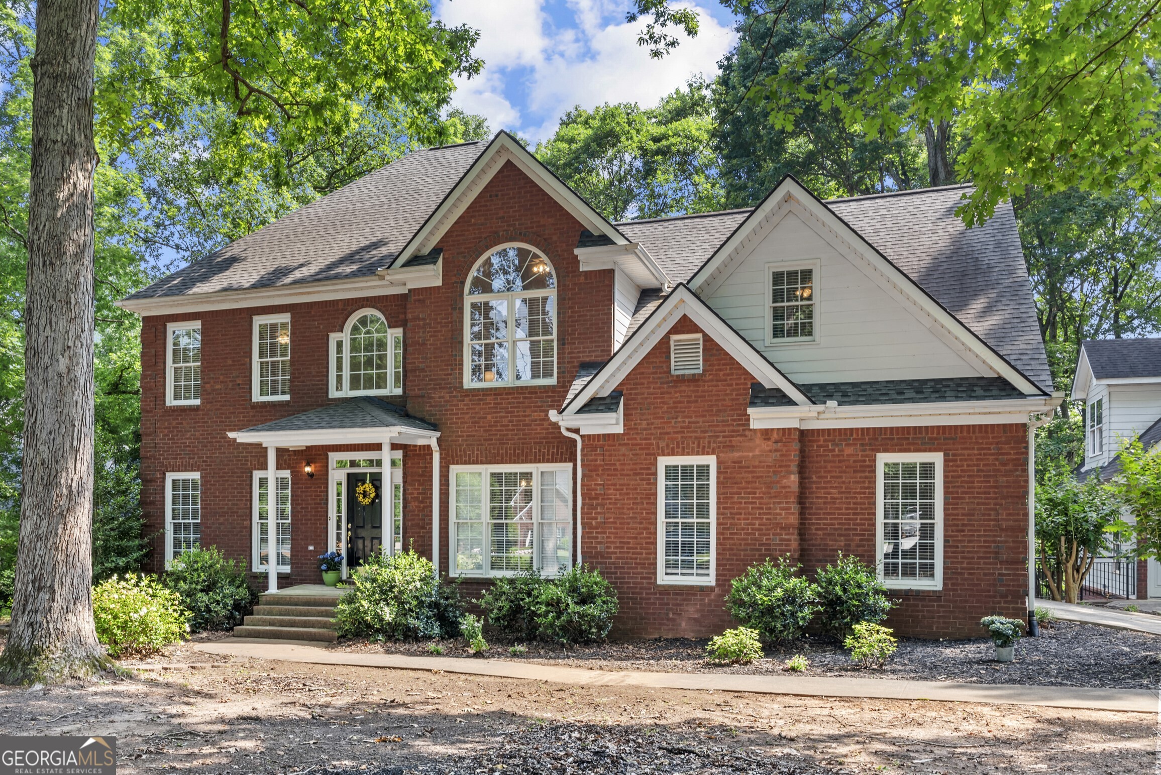 Located in the highly sought-after North Oconee school district, this spacious 5 bedroom, 3 bathroom home offers room for everyone with timeless charm and modern updates. Situated on a full acre, the 4-sided brick exterior offers durability and classic curb appeal. Inside, you'll find beautiful hardwood floors throughout the main level, a formal dining room, private study/formal living room, cozy den, and a guest suite with full bath-perfect for visitors or multi-generational living. The eat-in kitchen has been tastefully updated with brand new quartz countertops and stainless steel appliances, making it both functional and stylish. Upstairs, the oversized primary suite has trey ceilings, an oversized en-suite bath w/ jacuzzi tub, separate shower, and a huge walk-in closet. Also upstairs are three additional bedrooms, two full baths, and a finished craft room or flex space. The full, partially finished basement adds even more living space with a den and large rec room, which flows to the back yard, perfect for entertaining or relaxing. Outside, a detached two-car garage provides extra parking and storage options. With its flexible floor plan, modern updates, and fantastic location, this property is truly a must-see! This home couldn't be more centrally located, with Prince Avenue Christian School just across the road and North Oconee schools, downtown Watkinsville and Athens, with endless shopping, dining, and more only a few minutes away.