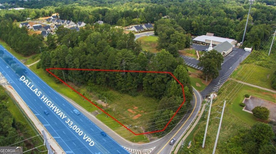 Prime Corner Lot on Dallas Highway & Mt. Calvary Road!  Don't miss this fantastic 1.76-acre corner lot offering unbeatable visibility and frontage on Dallas Highway (GA-120) at the intersection of Mt. Calvary Road. With a traffic count of approximately 33,000 vehicles per day, this property is ideal for high-exposure development.  Currently zoned LRO (Low-Rise Office Commercial), the site is perfectly suited for a professional office building-such as a dentist, attorney, real estate office, or medical practice.  All utilities are available, and septic approval is already in place.   You're welcome to stop by anytime to walk the property and see its full potential firsthand!