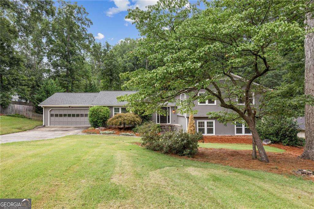 Charming, Renovated Gem in Indian Hills - Your Dream Home Awaits! Welcome to 1164 Fairfield Drive, nestled in the highly coveted Indian Hills subdivision where timeless charm meets modern updates in a perfect blend! This move-in ready beauty is freshly painted, boasting a newer roof and windows, all while exuding the comfort and style you've been searching for. As soon as you step inside, you'll be greeted by warm, espresso-colored wood floors that flow through the formal living and dining rooms, ideal for family gatherings, dinner parties, or cozy nights in. The open-concept kitchen is truly the heart of the home, featuring a spacious breakfast area and a bay window that invites natural light and overlooks the large, level backyard. It flows seamlessly into the inviting family room, complete with a brick fireplace and custom built-ins, offering the perfect space to kick back and unwind. Don't forget the covered porch, your new favorite spot to sip sweet tea while taking in the view of your expansive backyard, perfect for entertaining or just relaxing in peace. Need more room? You'll love the expansive media/bonus room, a versatile space that can transform into a teen suite, game room, or the ultimate retreat for relaxation and fun. Upstairs, you'll find four generous bedrooms, including the stunning primary suite. The completely renovated primary bath features luxurious finishes, and the guest bathroom has been thoughtfully updated with style and function in mind. This home offers an abundance of space, modern comforts, and a floor plan that works for everyone. Situated in the coveted Walton School District, with access to top-rated schools like Dickerson Middle School, it's the perfect place to raise a family and create lasting memories. Priced under $800,000, this home is the steal of the day in one of East Cobb's most desirable neighborhoods. Don't let this opportunity slip through your fingers, schedule a tour today and make this dream home yours!