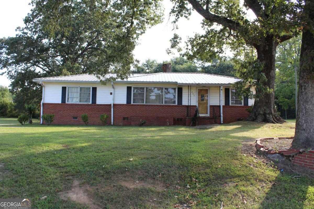 Don't miss out on this one! This three bed, two bath home has hard floors throughout and a larger utility room for your laundry and pantry area. Plenty of oppurtuntiy to renovate and make this house your home! Large, flat backyard with a longer driveway and two car carport. The carport area has a storage room that used to be the laudry area. This is a great place to store extra decorations and tools. Check this one out today!