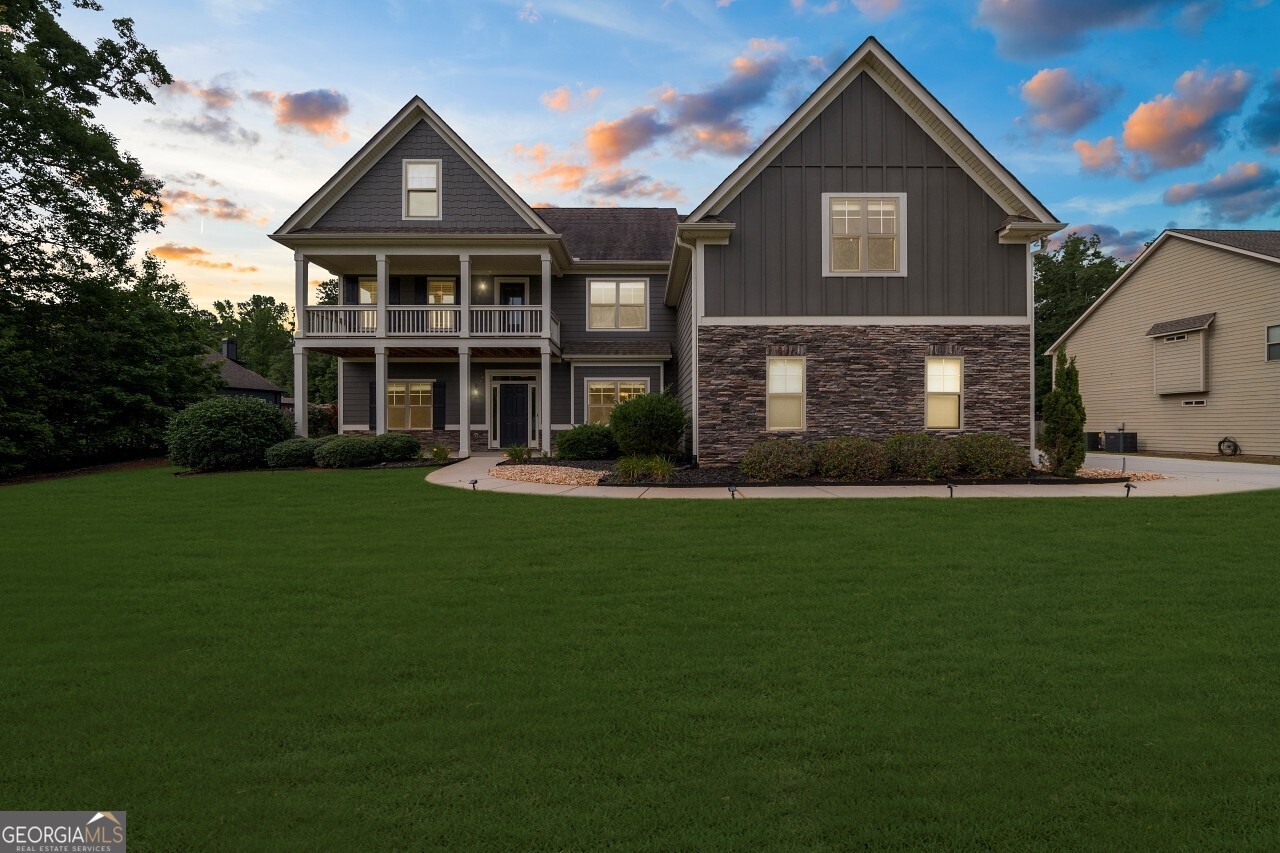 This home should not be priced this low. At $689,900, you're stepping into a $730K+ lifestyle for less only because an unexpected relocation forces the sale. Your gain is their loss. Nearly an acre in Herring Farms holds this 5BR/4BA Craftsman with 4,369 sq ft of elegance, soaring 10-foot ceilings, new flooring, fresh paint, and a marble waterfall master shower. The chef's kitchen flows seamlessly to a screened porch and outdoor fireplace overlooking a private, fenced retreat. Bonus room, office, and flexible spaces fit every season of life. Top schools. Easy Atlanta access. Homes like this don't get discounted until now.