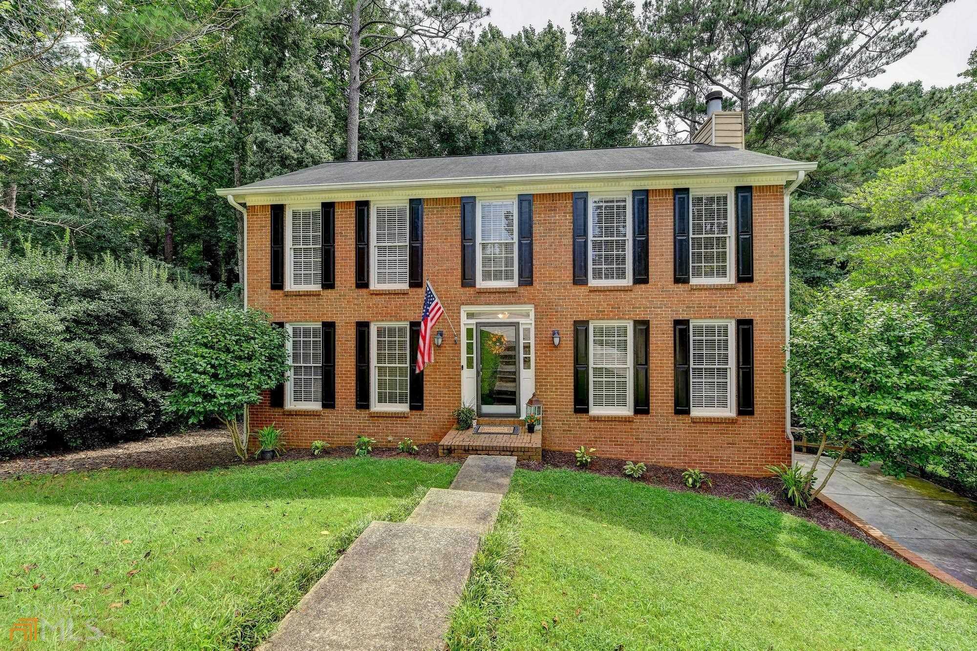 Private Lot! Ideal Location! Beautiful Move-In Ready Brick Front Home In Alpharetta. The Main Floor Includes a Sunny Eat-In Kitchen With White Cabinets, Stainless Steel Appliances, and Granite Countertops, Dining Room And a Large Family Room With a Fireplace, Built-In Bookcases, And a Wine Bar Nook. Just Off The Living Room Is a Deck That Overlooks a Very Private Backyard, Perfect for Entertaining or Relaxing. Upstairs, The Gererously Sized Owner's Suite Has Two Walk-In Closets, Double Vanities, And Custom Tiled Shower. Also, There Are Two Spacious Secondary Bedrooms And Upstairs Laundry. Custom Built-In Closets Are In Every Bedroom! The Finished Basement Has Newly Installed Laminate Floors And a Half Bathroom Making It a Great Flex Space Or Possible Fourth Bedroom. New Interior Paint. Newer Driveway. NO HOA. NO RENTAL RESTRICTIONS. Close to Shopping, Parks, GA 400, Schools, etc. SMART MOVE!!!