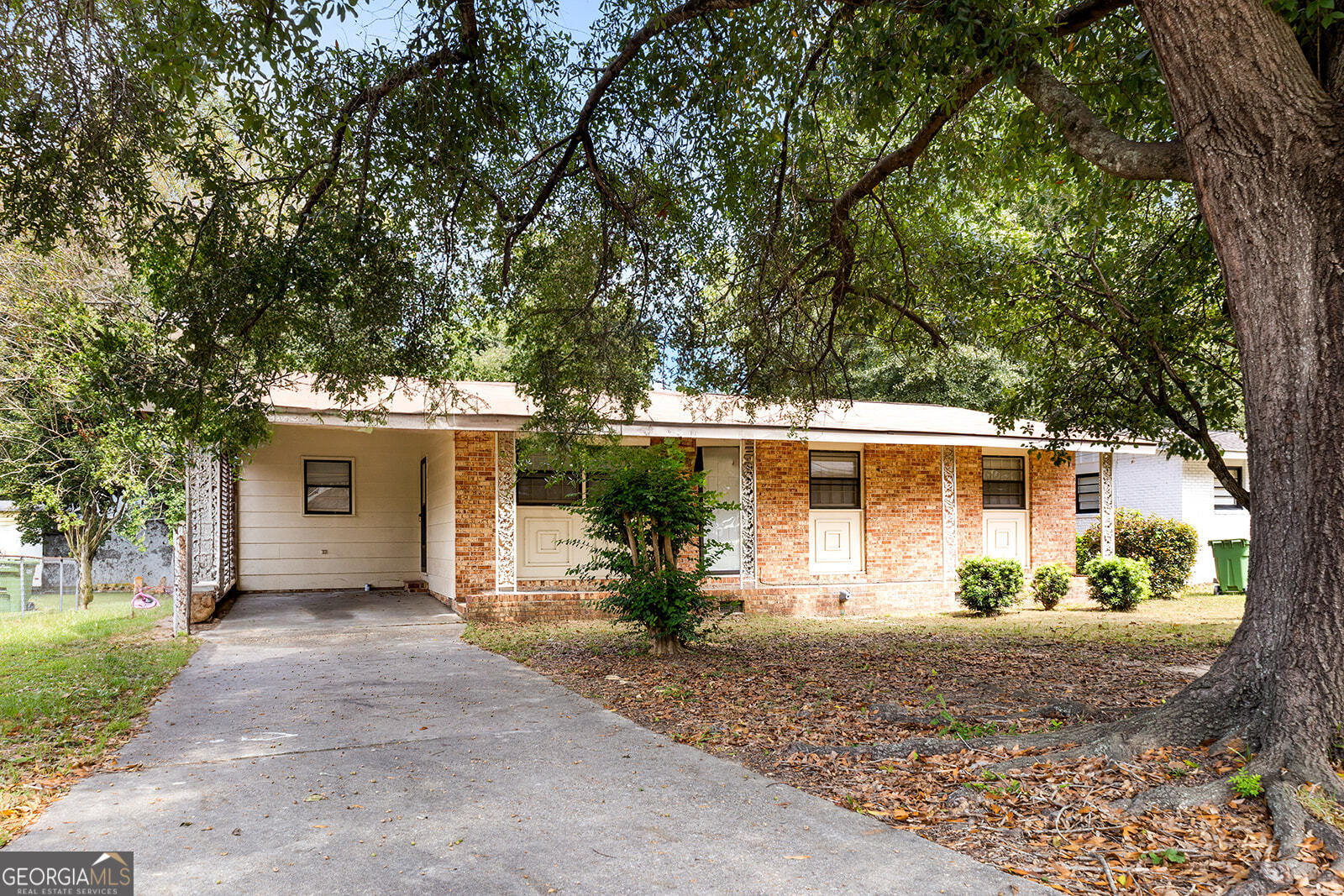 Please email hardmanhomeshelp@gmail.com to request showing. Welcome to this charming brick home featuring numerous recent updates! The roof, HVAC, and water heater are all just 2 years old. Inside, you'll find new ceiling fans, blinds, and luxury vinyl plank flooring in the kitchen, bonus/mudroom, hallway bath, and master bath, along with hardwoods throughout the bedrooms and main living areas. The kitchen is equipped with granite countertops, white cabinets, a new refrigerator, dishwasher, and electric oven with gas stove. A sliding barn door opens to the spacious bonus/mudroom with extra storage. Additional highlights include a laundry room with washer and dryer, one and a half baths, and a full shower. Enjoy the sizable backyard, back patio, and welcoming front porch, with plenty of parking offered by the driveway and carport.