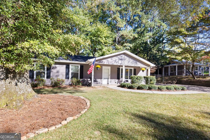 Beautifully renovated 3-bed, 2-bath home featuring a detached tiny-house ADU currently used as a short-term rental. The main home combines modern touches with classic charm-updated finishes, fresh paint, new flooring, and tasteful details throughout create a warm, inviting feel that's move-in ready.  Step outside to find the detached guesthouse-complete with its own entrance, full kitchen, walk-in shower, and private outdoor area-perfect for Airbnb, in-laws, or guests.  Located just minutes from Downtown Canton & Woodstock, The Mill on Etowah, Lake Allatoona, and The Outlet Shoppes, this property blends lifestyle, comfort, and investment value. Whether you're looking for your next home or an income-producing property, this offers flexibility and opportunity in one turnkey package.