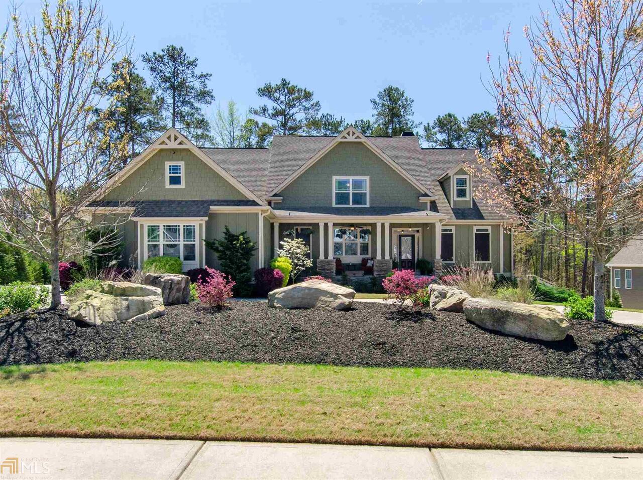 Beautifully appointed and well maintained 4 bedroom 4.5 bath Craftsman with unfinished basement on beautifully landscaped lot with covered front porch, side entry 3 car garage and circular drive. Fantastic features of this home include site finished hardwood floors on the main and exquisite trim and details throughout. Main level offers formal dining room with coffered ceiling and judges paneling, great room with beautiful built ins, wonderful bank of windows and stone surround fireplace, magnificent owner's suite with vaulted ceiling, ensuite with garden tub, tile shower, tile floors, double vanity and large walk in closet, dream kitchen with oversized island with breakfast bar, custom cabinetry, pantry, wall oven, built in microwave and gas cooktop, breakfast room, keeping room with wonderfully detailed wood ceiling, powder room, laundry room and secondary bedroom with private bath complete the main level. Upstairs offers two spacious bedrooms with private baths as well as a large loft/bonus room. Spacious unfinished basement stubbed for a bath - perfect for expanding your living space or ample storage leads to covered lower level patio. Phenomenal screened porch on main level with vaulted wood accent ceiling and outdoor fireplace overlooking fantastic rear yard. 3625 sf of living space plus 2348 sf unfinished basement. Neighborhood amenities include pool, tennis,clubhouse, playground and lake. Don't wait - this one will not last!