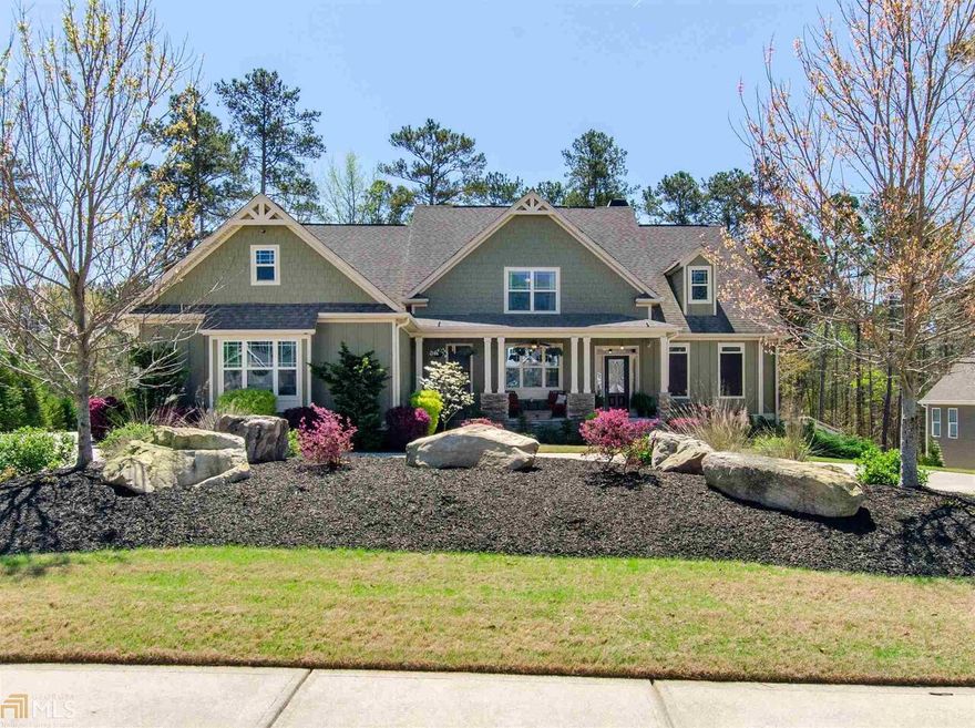 Beautifully appointed and well maintained 4 bedroom 4.5 bath Craftsman with unfinished basement on beautifully landscaped lot with covered front porch, side entry 3 car garage and circular drive. Fantastic features of this home include site finished hardwood floors on the main and exquisite trim and details throughout. Main level offers formal dining room with coffered ceiling and judges paneling, great room with beautiful built ins, wonderful bank of windows and stone surround fireplace, magnificent owner's suite with vaulted ceiling, ensuite with garden tub, tile shower, tile floors, double vanity and large walk in closet, dream kitchen with oversized island with breakfast bar, custom cabinetry, pantry, wall oven, built in microwave and gas cooktop, breakfast room, keeping room with wonderfully detailed wood ceiling, powder room, laundry room and secondary bedroom with private bath complete the main level. Upstairs offers two spacious bedrooms with private baths as well as a large loft/bonus room. Spacious unfinished basement stubbed for a bath - perfect for expanding your living space or ample storage leads to covered lower level patio. Phenomenal screened porch on main level with vaulted wood accent ceiling and outdoor fireplace overlooking fantastic rear yard. 3625 sf of living space plus 2348 sf unfinished basement. Neighborhood amenities include pool, tennis,clubhouse, playground and lake. Don't wait  - this one will not last!