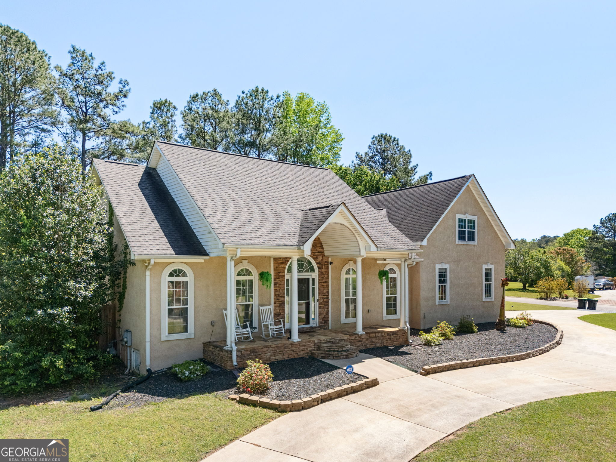Welcome to Heritage Ridge - Your Dream Home Awaits! Nestled on a beautifully landscaped corner lot in a sought-after executive community near Lake Spivey, this stunning ranch-style home has just received exciting updates that make it better than ever! Step inside to discover a spacious split-bedroom floor plan designed for both comfort and entertaining. You'll love the open concept layout featuring an open family room with fireplace, large kitchen with breakfast area, and a dedicated office/study perfect for working from home. The main-level owner's suite is a true retreat, complemented by two additional bedrooms and a full bath, along with a convenient half bath for guests. Upstairs, you'll find two versatile bonus rooms ideal for a teen suite, man cave, media room, or 4th bedroom, plus an additional full bath for added flexibility. Enjoy Georgia's beautiful seasons in your private backyard oasis-complete with a covered patio, newly installed sod and irrigation system, and a sparkling saltwater pool with a brand-new liner. It's the perfect setting for family gatherings and weekend relaxation. Located in a quiet, friendly neighborhood with top-rated Henry County schools, you're just minutes from I-75, the airport, shopping, and dining-yet tucked away in a peaceful community you'll be proud to call home.