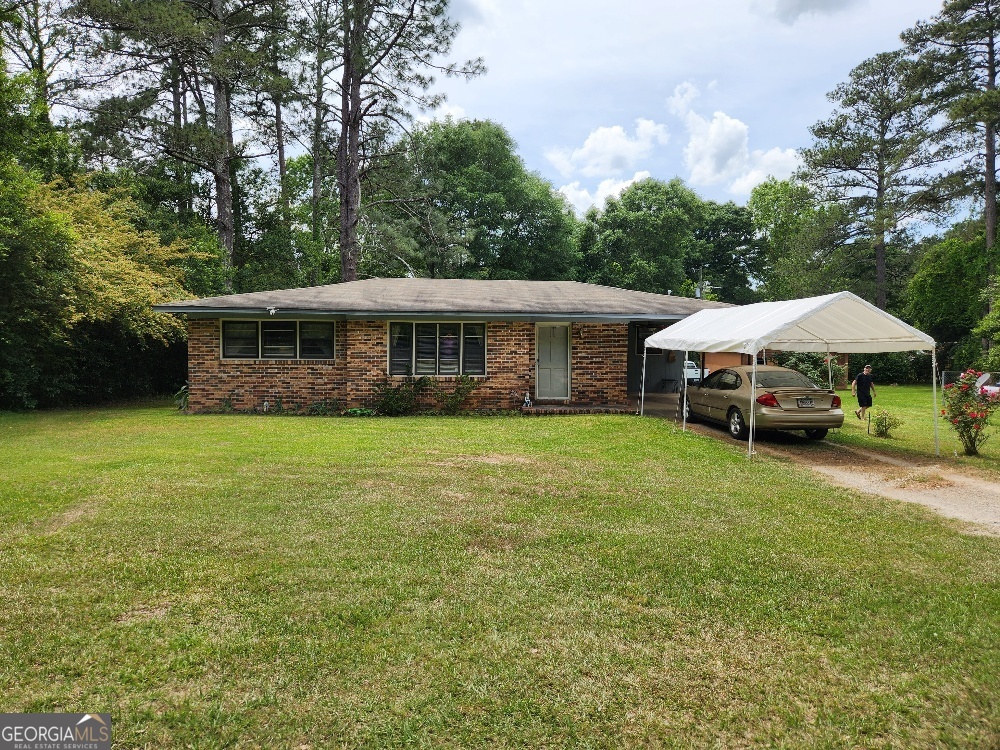 NO CITY TAXES! This charming house is located in a quiet country-living area within minutes from Fort Valley. 2-bedroom/1-bathroom cozy home that features a separate dining room that used to be a 3rd bedroom with a closet and French door leading to the large backyard that includes a 24'x24' wired workshop. Seller to install a new dishwasher. Smooth cooktop, in-wall oven and refrigerator stays. Huge Laundry Room. Gas furnace, but all else is total electric. Well water. Propane tank is leased. Must see to appreciate the secluded privacy.