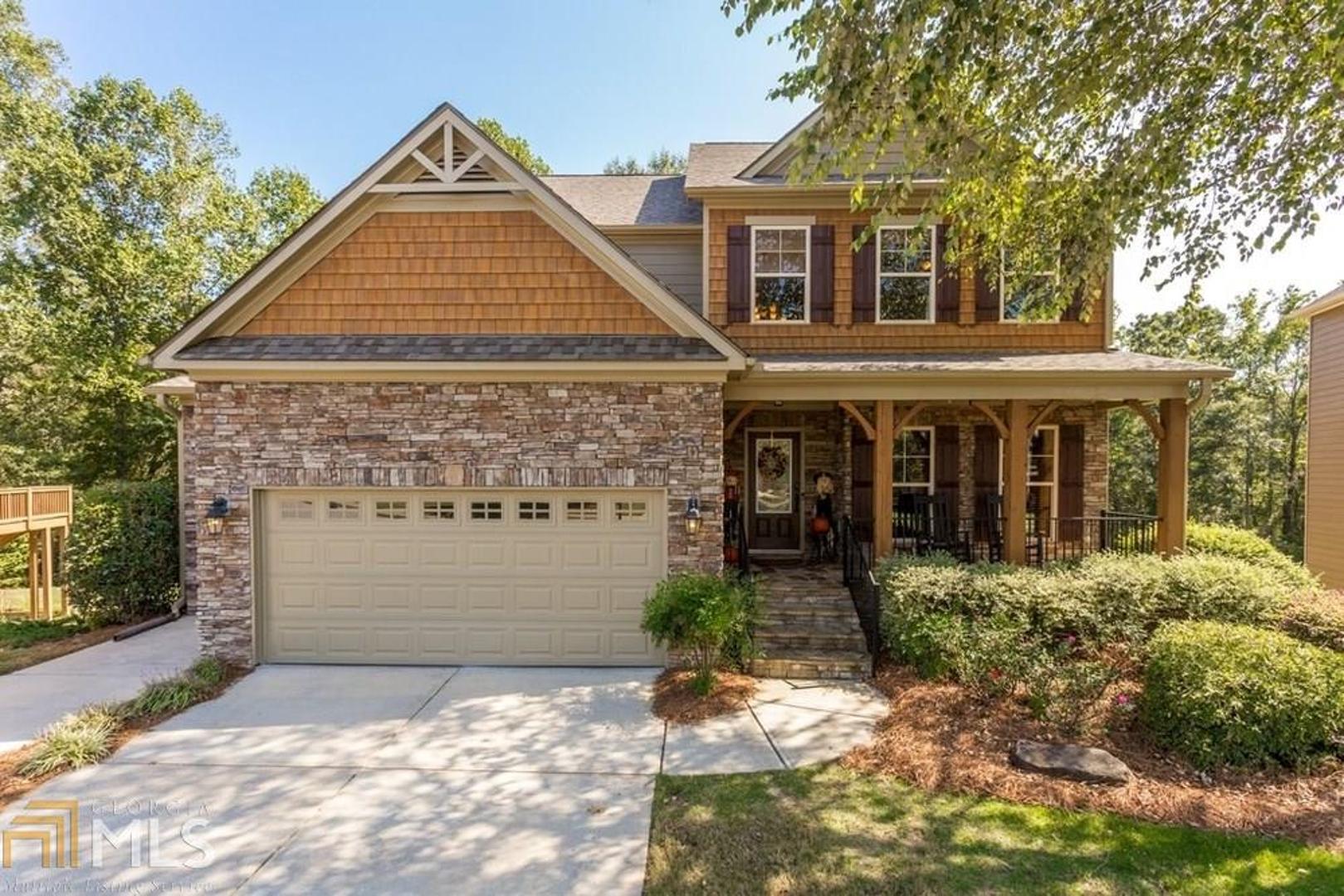 Amazing location convenient to 400. Great community with private access to Big Creek Greenway. Walk/bike to Fowler Park or Halcyon. Shake/stone facade-New roof 2018- Exterior painted Sept 2017 -Expansive and Private backyard backs Padgetts Preserve- near end of cul de sac street- level driveway- Golf cart garage-tankless water heater- open floorplan with tons of light- possible 5th bdrm in basement- Double sided fireplace. His/Hers vanities and walk in closets! Excellent schools Denmark High!