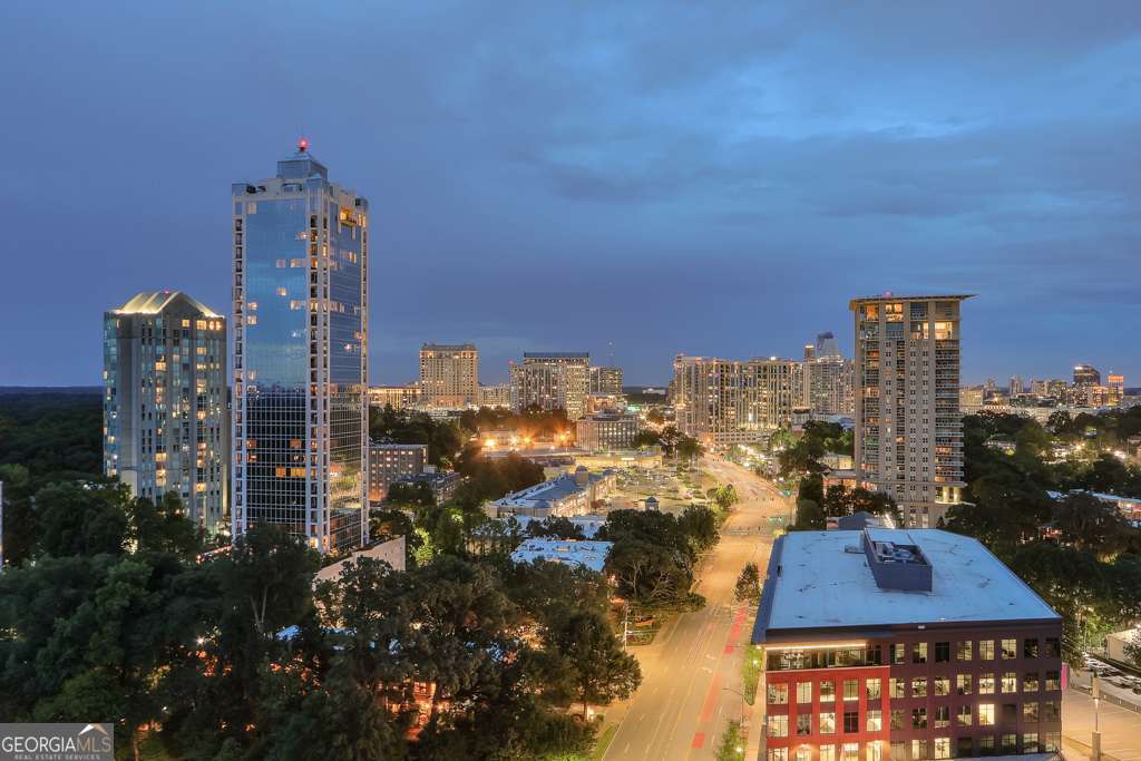 Sophisticated Buckhead living with unmatched views in this 2 bedroom 2.5 bath. Perched high above Peachtree Road, this beautifully updated 18th floor residence blends modern elegance with everyday comfort. Renovated kitchen with beautiful cabinetry and appointments, signature designer lighting, built in cabinetry, built in storage in every room. All this sets a warm yet refined tone throughout. Step onto your private balcony and take in sweeping city views. Breathtaking sunsets and the sparkling lights of Buckhead at night. This unit has a storage unit and 2 premier parking spaces. The buildings exceptional amenities include a fully equipped fitness center, lighted pickle ball and tennis courts, grilling, outdoor fireplace, dog park, library, club room with catering kitchen, 24 hour concierge service, 3 guest suites, heated pool. Conveniently situated near the shops of Buckhead, high end restaurants, and parks.