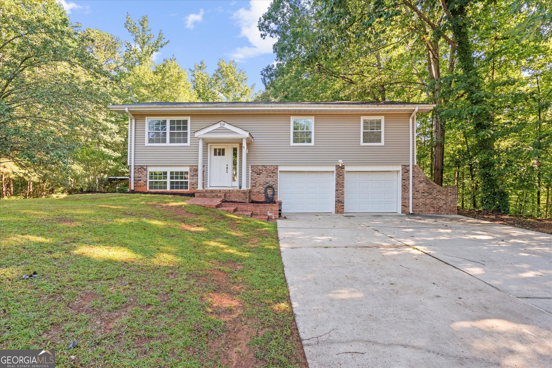 Welcome to 115 Riviera Drive - a rare blend of privacy, space, and convenience in the heart of West Georgia! Nestled on a sprawling 1.22-acre lot, this charming home offers the perfect retreat with room to breathe. Whether you're enjoying a quiet morning on the porch or hosting a weekend gathering, you'll love the sense of seclusion that's hard to find at this price point. Located in a prime location, you're just minutes from the vibrant amenities of Carrollton-including shopping, dining, and top-rated schools-while also enjoying quick access to Villa Rica, I-20, and Atlanta for an easy commute. Inside, you'll find a well-maintained home with a finished basement, ideal for storage, hobbies, or future expansion. Need extra space for work or play? The property includes a massive storage building/workshop-perfect for a home business, creative studio, or serious hobbyist. This is more than a home-it's an opportunity to live surrounded by nature without sacrificing location or convenience. Don't miss your chance to own this private retreat at an incredible value!