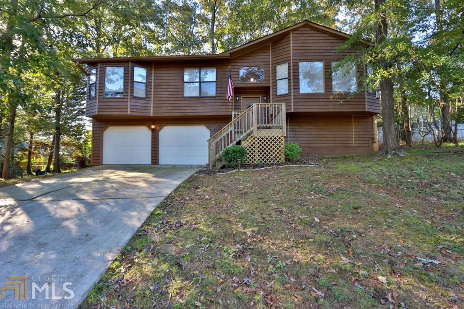 Welcome to this home in the highly sought after Pepperwood Community. This home, with beautiful cedar siding, is a split-level plan perfect for those who enjoy privacy. It features a large living room with a rustic fireplace and a back deck with a view of Stone Mountain over the tree line. Any outdoor fanatics will enjoy the availability of ample hiking with Stone Mountain being only a mile away. The kitchen boasts lovely white cabinets that open up the space and an electric stovetop. Dona???t forget the multiple walk-in closets and the finished basement with an entertainment room and access to the fenced-in backyard!