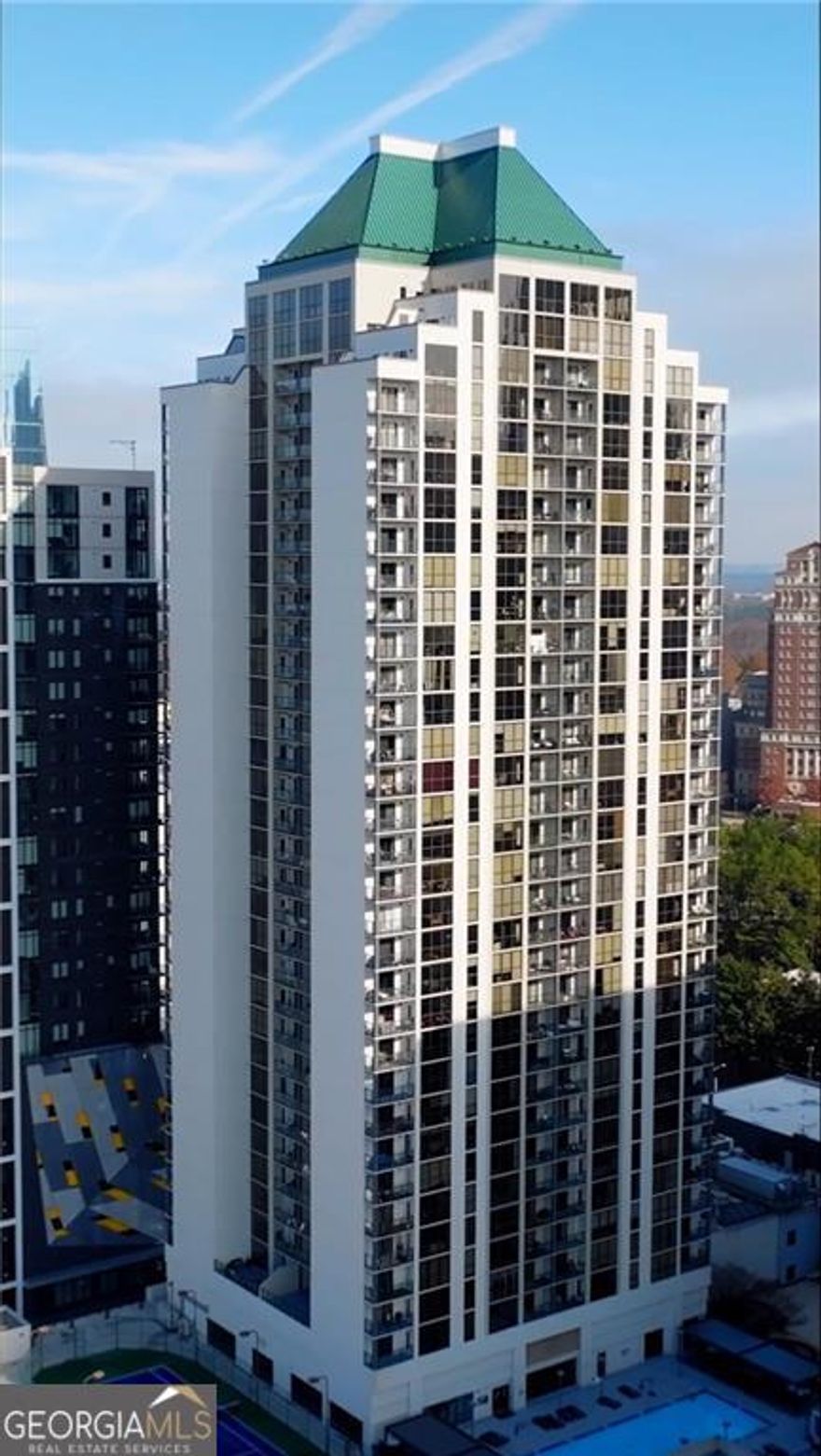 A view that captures the city and your heart. From the moment you step inside this 36th-floor condo, the city unfolds before you. Floor-to-ceiling windows fill the living room with natural light and frame breathtaking 180-degree views-stretching from Midtown's skyline to the Mercedes-Benz Stadium in the distance. Step out onto the balcony, feel the breeze, and watch the city come alive beneath you. The open layout feels warm and inviting, with thoughtful details throughout. The owner's suite is a peaceful retreat with a walk-in closet, an updated bathroom, and direct access to the balcony-perfect for morning coffee or quiet evenings. The second bedroom offers its own full bath and a spacious closet with built-in shelving. The kitchen is fully equipped with a refrigerator, range, microwave, and LG washer/dryer combo for convenience. Built-in cabinets line the hallway, adding extra storage while keeping the space sleek and uncluttered. This condo community is packed with amenities designed to elevate your lifestyle. Enjoy a fully equipped fitness center, an inground pool, basketball court, tennis and pickleball court, an indoor racquetball court, a billiards room, and a private meeting spaces. There are plenty of spots to relax, unwind, or gather with friends without ever leaving the building. Right outside your door, the best of Atlanta is within walking distance. The Arts MARTA Station is just across the street, making commuting easy. You're minutes from The High Museum, Woodruff Arts Center, and the Alliance Theatre. Whole Foods and Colony Square are nearby for dining, movies, and weekend outings. Cross the bridge and you're in Atlantic Station, surrounded by shops, restaurants, and entertainment. Whether you're watching the sunrise with a cup of coffee or taking in the city lights at night, this home gives you a front-row seat to everything Atlanta has to offer.
