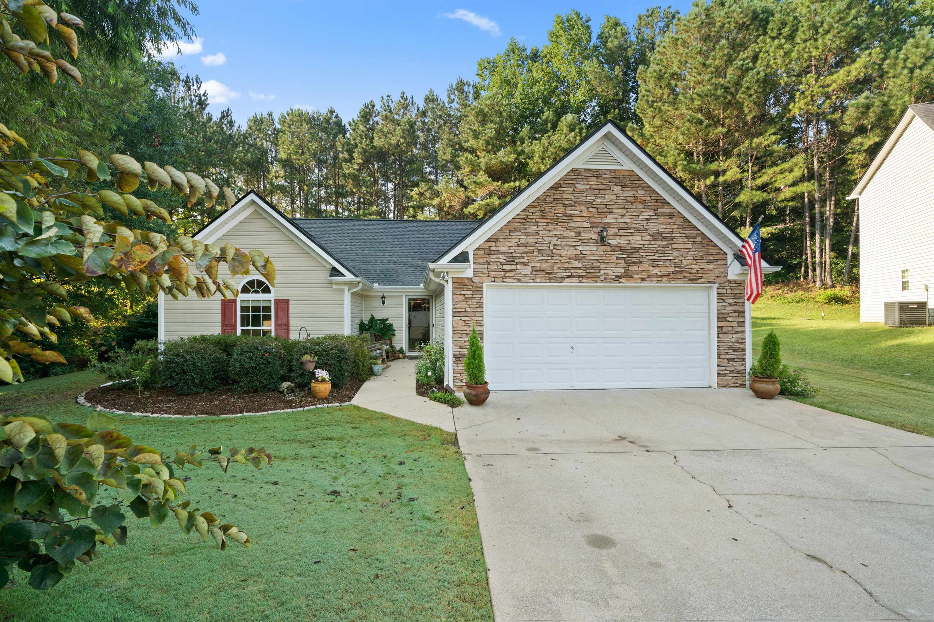 This adorable 3-bedroom, 2-bath step-less ranch home is a hidden gem waiting for you! Nestled in a quiet cul-de-sac, it offers the perfect blend of comfort and convenience.With approximately 1542 square feet of living space, this home is as practical as it is charming. The kitchen has been tastefully updated with sleek quartz countertops, a subway tile backsplash, and stainless steel appliances, including a farmhouse sink. Cooking here is a joy! Both bathrooms have been beautifully renovated, with the secondary bathroom featuring a luxurious walk-in shower. Upgrades within the last five years include a new roof with architectural shingles, a new HVAC system, a Rachio wireless irrigation system, a Nest thermostat, and a Nest doorbell, ensuring you're not only comfortable but also connected. Every bedroom comes with a walk-in closet, giving you ample storage space. The split bedroom plan offers added privacy for those in the home. The custom landscaping is a delight, with flowering plants, hostas, hydrangeas, roses, and more adding color and character to your surroundings. Step into the backyard, and you'll find a 6ft wooden privacy fence providing the perfect backdrop for your outdoor oasis that includes raised garden beds and a colorful pollination garden. There's an 8x10 storage building , easily accessible from both the front and back yards, for all your tools and toys. As a bonus, this home is adjacent to lot that is not able to be developed, ensuring your privacy and tranquility. Location-wise, this home couldn't be better situated. Enjoy easy access to shopping, schools, hospitals, and Interstate 20, making daily life a breeze. Don't miss this opportunity to make this adorable house your home sweet home!