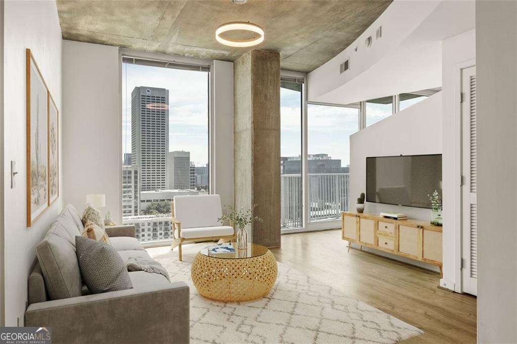 Seller Has Relocated And Motivated Price To Sell**Located In The Iconic Spire Bldg In The Heart Of Midtown**Atlanta's Most Vibrant & Popular Live, Work, & Play Neighborhood W/Walk Score Of 93**Open Yet Defined Layout W/Gallery Style Entry Foyer & Open Living/Kitchen Concept W/ *Rare* Dedicated "Flex" Space Perfect For Dining/Office**NEW HVAC, Water Heater, & Modern Flooring**All Rooms Offer Full Wall Of Floor To Ceiling Glass W/180 Degree Jaw Dropping South Facing Views**Large Master Suite W/Walk-In Closet & Spa Style Bathroom W/Private & Guest Entry**Sleek Resort Quality Amenities Level W/24 Hr Concierge**Located in the heart of Midtown at Peachtree & 7th (Walk Score 93), steps from grocery (Publix, CVS, Whole Foods), dining, theaters, parks (Beltline, Piedmont Park), MARTA, and more. VA & Conventional financing available