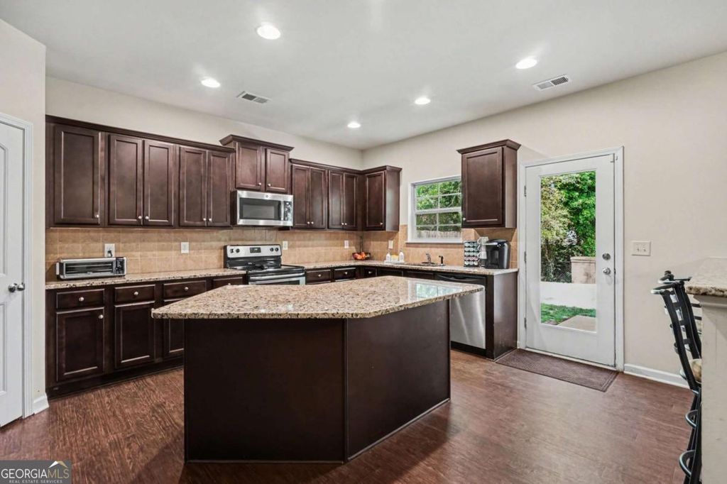 Photo of 1380 Napa Valley Drive, Lawrenceville, GA 30045 (MLS # 10739478)