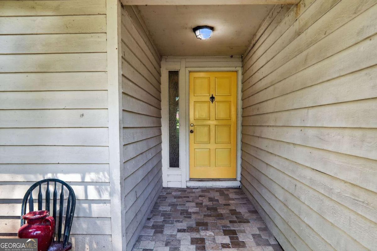 Awesome floor plan in great location and established neighborhood. Paver entryway leads to desirable split bedroom ranch, with huge great room, wet bar, custom fireplace, four season sun room, large kitchen with dining room. Primary bedroom features spa tub, private bath, large walk in closet and access to deck. Two additional bedrooms, guest bath. Laundry closet and two car garage. Great location convenient to highways, restaurants, grocery stores, shopping and stores. Don't miss this golden opportunity to get in at a good price and make it your own! Tax records do not reflect correct square footage. Appraisal - 1873 square ft.