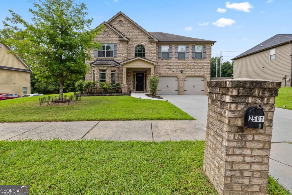 Luxury Living in Brittany Park - Over 3,500 Sq Ft of Elegant Space with Solar Efficiency - Welcome to Brittany Park, one of Ellenwood's most desirable and exclusive communities. This beautifully maintained 4-bedroom, 2.5-bath residence offers over 3,500 square feet of refined living space, seamlessly blending elegance, comfort, and energy efficiency-just 20 minutes from Atlanta Intown and Hartsfield-Jackson Airport. Step into a grand two-story foyer with soaring ceilings that set the tone for this thoughtfully designed home. The main level features a formal living room or flex space with a charming bay window, and a separate dining room enhanced by coffered ceilings-perfect for hosting guests in style. The chef's kitchen impresses with rich dark cabinetry, luxury vinyl plank hardwoods, a large center island, wraparound granite countertops, a breakfast bar, and a light-filled breakfast area overlooking the sunken family room. Step outside to a private, covered patio and fully fenced backyard-ideal for entertaining or quiet moments of retreat. Beautiful archways throughout the home add architectural elegance and flow. Upstairs, double French doors lead to the oversized primary suite featuring a spa-like bath with a soaking tub, separate glass-enclosed shower, and generous walk-in closets. Three spacious secondary bedrooms share a full bath with double vanities, offering comfort for loved ones or guests. Energy-saving solar panels add to the home's value and efficiency. And with no homeowners association, Brittany Park offers the freedom of homeownership in a well-kept, established community that is sure to impress. Enjoy close proximity to Ellenwood shops, dining, and major expressways-this is luxury, space, and convenience all in one exceptional home. This one will not last-schedule your private tour today!