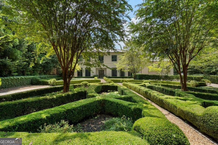 Beautifully designed custom home in Buckhead, situated on a private 1-acre lot. This stunning modern-transitional residence was meticulously crafted by AFG Builders under the thoughtful guidance of Harrison Design. This home showcases timeless architectural design and exquisite craftsmanship. As you step into the two-story foyer with stone floors on the main level, you're greeted by the open living room space featuring 12 foot ceilings and a wall of glass with doors that walk out to the pool. The quality of construction is evident, featuring triple-locking solid wood doors throughout. Beyond the pool, you'll find a spacious fenced yard that's part of the property, offering the perfect space for activities like pickleball.  The main floor has a second primary bedroom with french doors out to the pool as well as the main primary bedroom suite upstairs.  The primary bedroom upstairs features  a study, fireplace, a private terrace and two exceptionally large dressing rooms. Additionally, there are three secondary bedrooms, each with an ensuite full bathroom, provide ample accommodation options. An elevator conveniently connects all three floors. The all glass second stairwell lets in exceptional lighting and is a sculptural masterpiece in itself.  The main stairwell is signature Harrison Design with large windows and a wrap around stair up to the second floor primary suite.  The dining room opens to the garden and grilling area, creating a seamless connection between indoor and outdoor living spaces. The sleek kitchen and breakfast room feature gorgeous countertops, stainless steel appliances, custom cabinetry, a large walk-in pantry and separate coffee bar station. The family room, complete with a fireplace, opens to an enclosed screened porch next to the pool. Additional outdoor amenities include a pool bath and an outdoor shower.   The daylight terrace level is an entertainer's dream, offering a kitchen, billiards area, fireplace, wine cellar and a full bath. It also serves as an excellent guest apartment.  An additional room can be used as a media room, gym, or golf simulator space.  This custom eco-conscious home was constructed with sustainability in mind. Features such as insulated concrete exterior walls, icynene insulation in the attic for airtight energy efficiency, a standing seam metal roof, solar panels for water heating, and a circulating hot water system for reduced water usage exemplify its commitment to sustainability. Throughout the home, you'll find earth-friendly materials like recycled glass and sustainable woods, including alder doors/windows and lyptus floors. Located in the highly sought-after 30327 zip code on the West side of Buckhead, this property boasts the most coveted address in the area.  Embraced by a lush tree canopy, the estate-sized lots surrounding this home provide an enchanting natural setting. Its prime location offers easy access to all that Atlanta has to offer, including top-notch restaurants, excellent schools, a mere 30-minute drive to the airport, and much more.