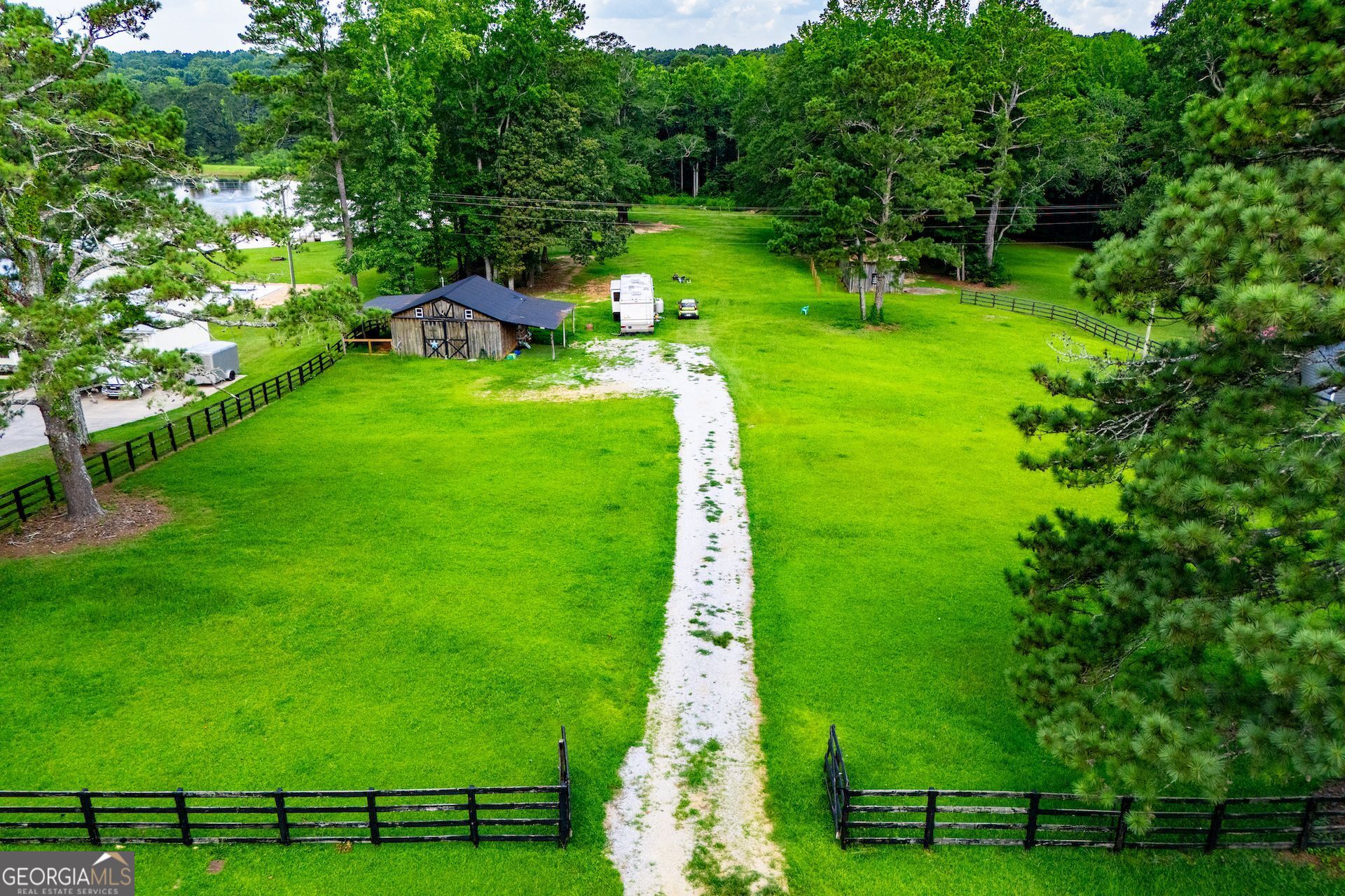 Discover the perfect canvas for your dream home on this 2.1-acre cleared and level lot located in one of Carrollton's most sought-after areas. This beautiful piece of property is build-ready with water and electric already available, perc test completed, and propane gas accessible. Nestled in a peaceful setting, the land features a 26x26 barn with a cozy wood-burning stove, ideal for storage, hobbies, or a rustic workshop. There's also an RV/camper hookup on site for added convenience or temporary living while you build. Enjoy creek access at the back of the property, lake views, and a touch of history with an original 1800s chimney that adds charm and character to the landscape. Whether you're looking to build your forever home, invest in land, or escape to a serene retreat, this property offers a rare combination of location, readiness, and unique features. Don't miss out- come walk the land and experience its beauty for yourself!
