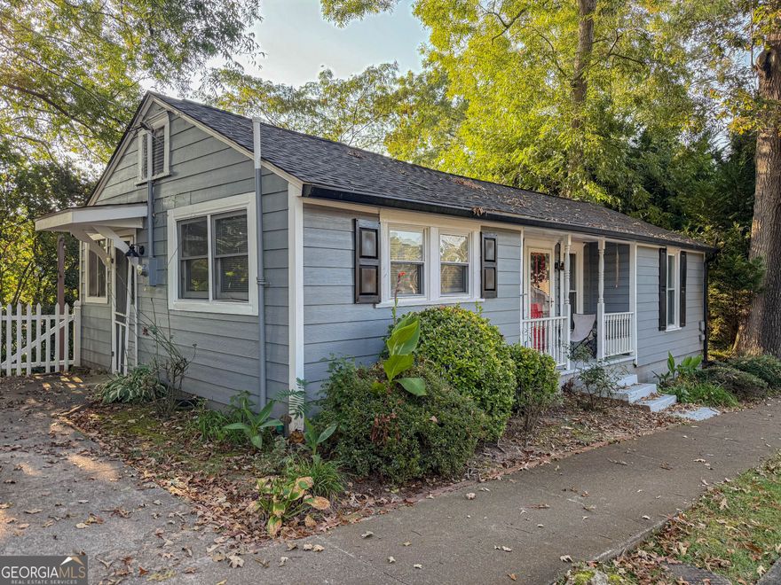 Take the opportunity to own this one-bedroom cottage nestled in the heart of Downtown Acworth's sought after golf cart district. This charming property perfectly captures the essence of lake town living with its cozy, light-filled interior and welcoming front porch-ideal for morning coffee or evening conversation.  Just a short distance on a golf brings you to the sparkling waters of Lake Acworth, where scenic walking trails and peaceful views create the perfect spot to relax and unwind. The historic downtown square is only minutes away, offering award-winning restaurants, local boutiques, art galleries, and a vibrant community center with indoor pickleball courts.  Acworth is known for its small-town charm and big amenities, from lively seasonal festivals and concerts to inviting parks and beaches. Enjoy weekends exploring the trails around Lake Acworth and Cauble Park, spending time on the beach, or joining neighbors at one of the many local events that make this community so special.  Whether you're looking for a cozy full-time residence, a stylish weekend retreat, or an income-producing investment property, this cottage offers more than just a home, it offers a lifestyle. Experience the perfect blend of recreation, relaxation, and historic character in one of Metro Atlanta's most charming lakefront communities.