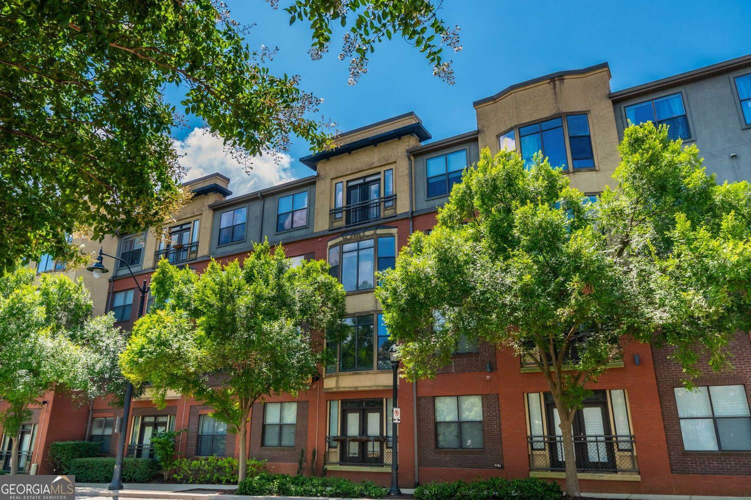 Spacious 1-bedroom with TWO deeded parking spaces-tough to find in Atlantic Station. This unit has wide open living, a wraparound breakfast bar, and space for a proper dining area or home office. It's also handicap accessible with wider doorways, lower counters, and railings throughout. Hardwood floors, a screened-in porch that overlooks the courtyard, and an oversized bathroom make it feel even larger. It's an interior corner unit right next to the elevator-easy access in and out. Art Foundry has top-notch amenities: full gym, locker rooms, pool, grilling area, and clubroom. You've also got The Commons park right across the street-like having your own Piedmont Park next door. Walk to everything: grocery, Target, IKEA, restaurants, shops, and the Microsoft campus. Minutes to GA Tech, West Midtown, and both interstates. This is city living made easy.