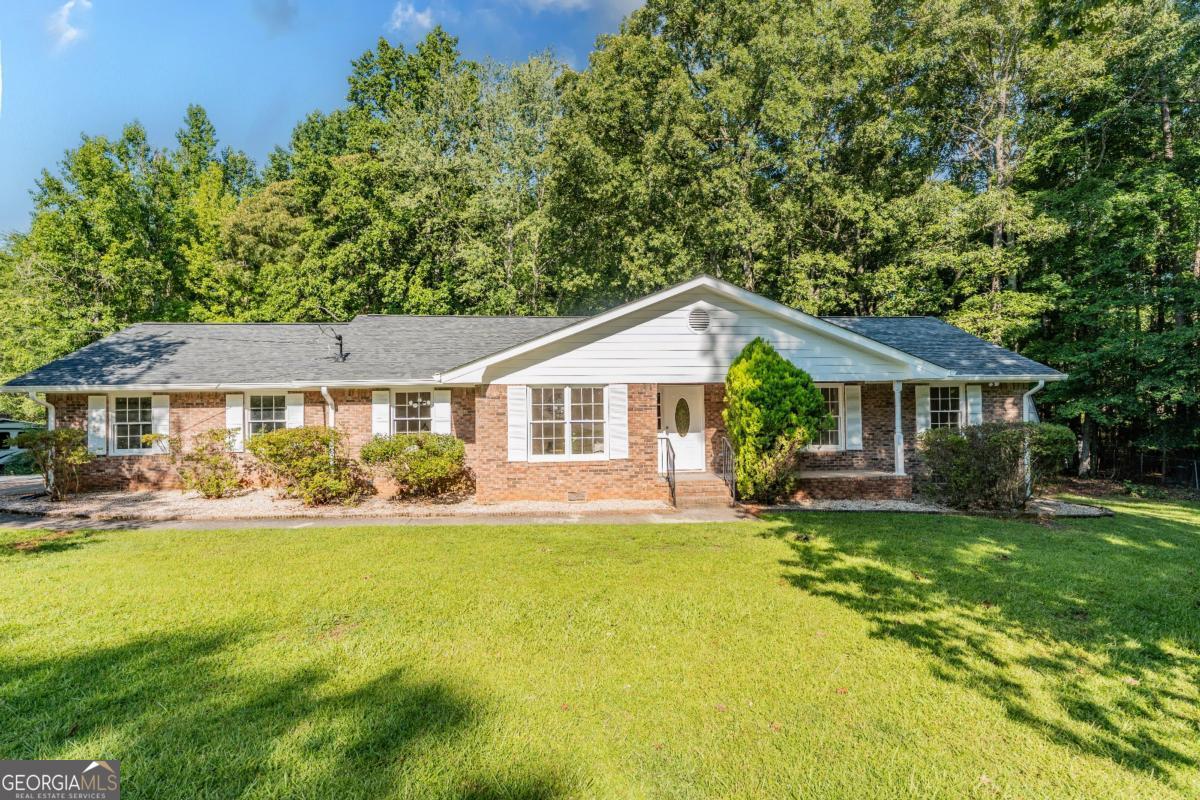 This beautifully renovated home sits on 1.01 acres and blends modern comfort and style with pops of vintage charm throughout. Enjoy a sleek kitchen with brand-new appliances. The primary suite has two separate closets, giving each person their own dedicated space. This primary bathroom is designed for relaxation, complete with a modern spa like standalone tub, walk-in shower, and elegant finishes. The home also features a 2-car garage, extended driveway for extra parking, and two storage sheds for all your things. Relax on the patio or host on the large deck overlooking a your large private yard. Don't miss this opportunity! This move-in ready home is PRICED TO SELL! and offers the lifestyle you've been looking for!
