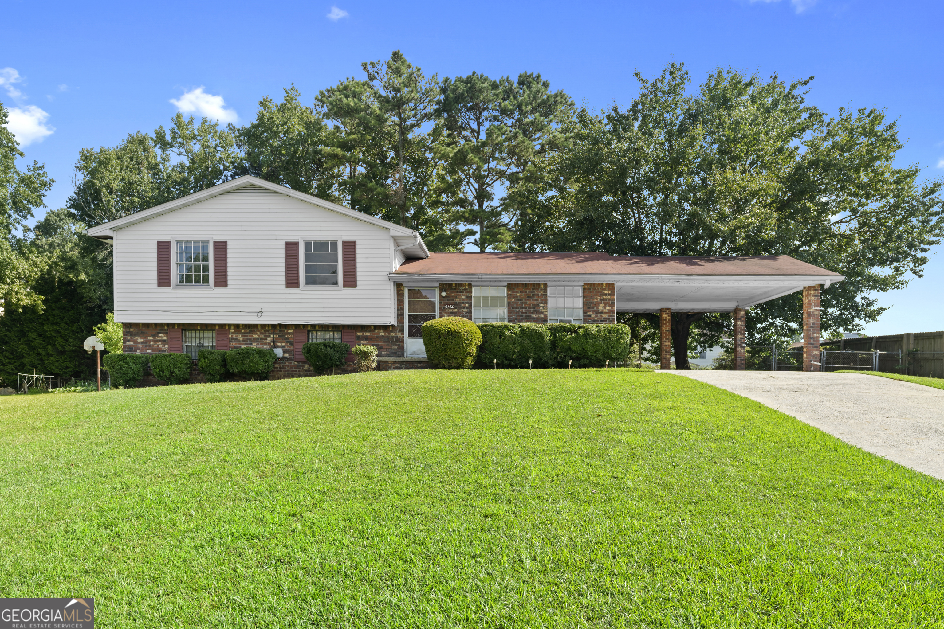 Come see this 4-bedroom, 2-bath split-level home in Riverdale, conveniently located near Interstate 75. The main level offers a spacious open floor plan with a living room, dining area, and kitchen. Upstairs, you'll find the master suite along with two additional bedrooms and another full bathroom. The lower level includes a bonus room that could be used as a bedroom, plus storage space and a laundry room. Other highlights include a fenced backyard, rear patio, and a 2-car carport.