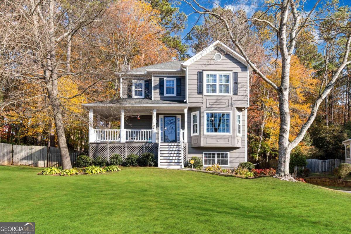 Nestled in the serene and sought-after Spicers Grove community, this captivating home is a perfect blend of comfort and style! Step into the welcoming 2-story foyer, where natural light pours into the open-concept main level, highlighting the beautiful hardwood floors throughout. The fireside family room creates a cozy centerpiece, offering seamless views of the breakfast area, chef-inspired kitchen, and the lush private backyard. Upstairs, the spacious trayed owner's suite is a true retreat, featuring a spa-like bathroom with abundant natural light. Two additional bedrooms, a full bath, and a convenient laundry room complete the upper level. The large, private backyard is an entertainer's dream, complete with an expansive deck perfect for gatherings, grilling, or simply unwinding. Whether you're hosting friends or enjoying quiet moments at home, this property offers the ideal setting for both relaxation and connection. Don't miss your opportunity to own this exceptional home in a prime location -schedule your showing today!