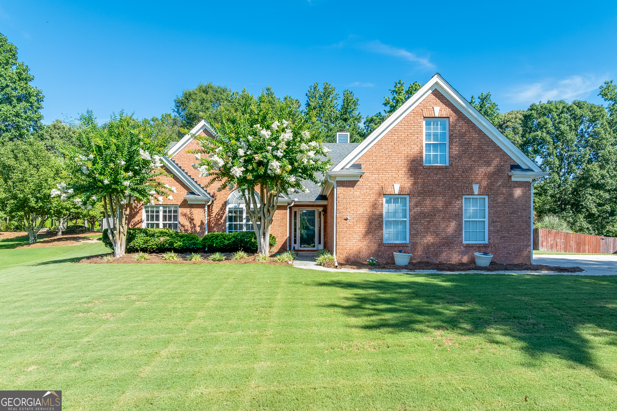 Welcome to this beautifully maintained 4 bedroom, 2.5 bath brick-front ranch situated on a spacious, level lot in a quiet Dacula neighborhood. Located just one mile from Harbins Elementary, only 5 minutes from scenic Harbins Park, and close to Hwy 316 for easy commuting, this home offers both comfort and convenience. Step inside to discover a well-designed floor plan featuring a large kitchen with granite countertops, a center island, and ample cabinet space - perfect for cooking and entertaining. Enjoy meals in the separate dining room, or relax in the sunroom filled with natural light. The master suite is conveniently located on the main level, offering privacy and comfort. Two additional bedrooms are also on the main floor, while the spacious upstairs bonus room-with closet-can serve as a 4th bedroom, home office, or playroom. Outside, you'll find a fenced backyard ideal for kids, pets, or outdoor gatherings. A 3-car garage and level driveway provide plenty of parking and easy access. This home has it all - space, style, and a great location. Don't miss the opportunity to make it yours!