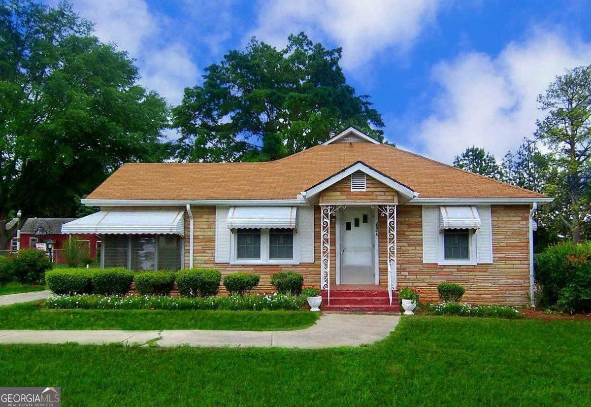 Adorable mid-century modern bungalow in the heart of Lawrenceville. 2 bedrooms, 1 bathroom. Enclosed porch, mudroom off of kitchen, covered parking carport. Walk to downtown Lawrenceville in less then 1 mile! Fenced in backyard - dogs allowed, but no cats due to owner's severe cat allergy. Original hardwood floors, doors, and all the charm! You won't find a better deal around Lawrenceville! Tenant responsible for $150.00 monthly landscaping maintenance as well.