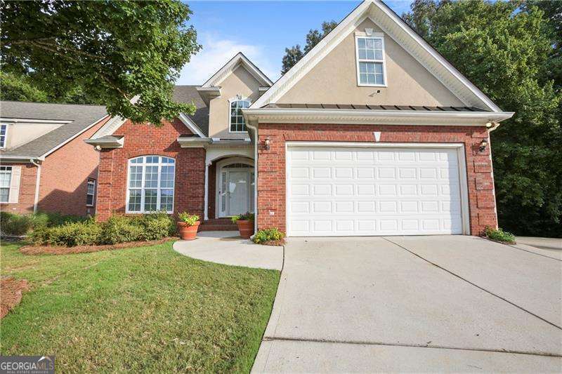 Where can you find 4-sided brick, gated access, and resort-style amenities at this price? Welcome to Spivey Village - an Active Adult community offering comfort, convenience, and peace of mind. This updated 4-bedroom, 2.5-bath home features fresh paint, new flooring, and an open layout. Tucked away on one of the most private homesites, it includes a covered porch perfect for relaxing or entertaining. The basement provides approximately 1700 additional square feet. Enjoy a clubhouse, pool, lawn care, and easy access to trails, sports facilities, and the Griswold Senior Center. Built for lifestyle. Priced for value. Only in Spivey Village.