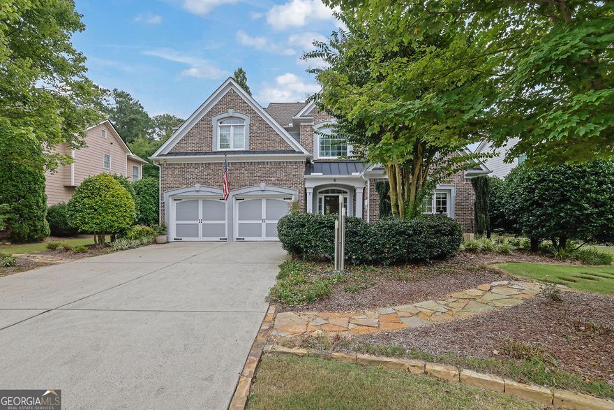 Beautiful and well-maintained traditional in sought-after Lakefield Manor!  Nestled on nearly a half-acre lot, this elegant home offers exceptional space and charm. The main level features hardwood floors throughout, a stunning two-story foyer, and a soaring two-story great room. The formal living room flows seamlessly into the formal dining room, perfect for entertaining. A versatile main-level bedroom, currently designed as a home office, is accompanied by a full bath. The bright eat-in kitchen opens to the family room and overlooks a stone patio and an expansive, garden-friendly backyard. The beautifully landscaped garden and charming shed were even featured in the Atlanta Journal-Constitution! Upstairs, the spacious primary suite includes a sitting area, extra closet space, and a large walk-in closet. The ensuite bathroom offers separate his-and-hers vanities, a relaxing garden tub, and an oversized shower. Two additional bedrooms share a large, updated hall bath. Lakefield Manor offers a true community lifestyle with 2 swimming pools (main and kiddie), 2 tennis/pickleball courts, walking paths, 3 stocked lakes, a playground, and a central park with a picnic pavilion and fire pit-the perfect gathering spot for neighborhood events. Conveniently located within walking distance to Cheatham Hill Elementary, and just minutes from shopping, dining, and the vibrant Marietta Square, this home offers the ideal blend of comfort, convenience, and community.