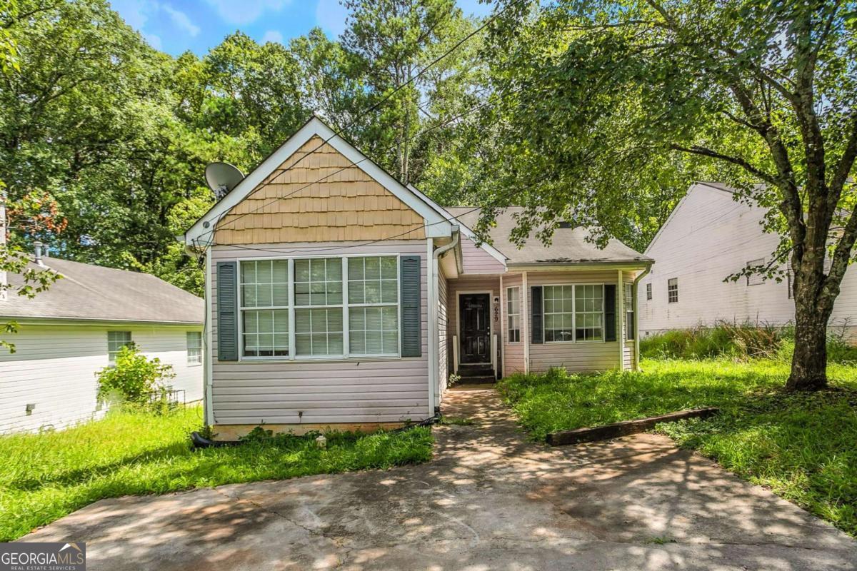 Spacious 4-bedroom, 2-bath ranch in a quiet Southeast Atlanta neighborhood. The layout includes a large living room with fireplace, separate dining area, and a functional kitchen with plenty of cabinet space. All bedrooms are on one level, offering flexibility for guests or home office use. The lot is level with a private driveway and easy-to-maintain yard. Located with quick access to I-75, the airport, and downtown.