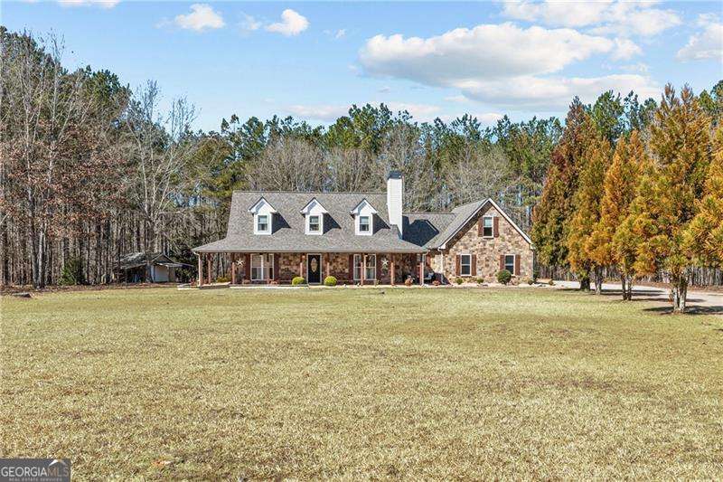 Discover the charm of country living in this stunning home set on 5 fenced acres of serene landscape. This property features a versatile work barn, a custom stone fire pit, and ample space to cultivate your dream garden. Step inside to discover a bright, inviting interior where the spacious kitchen features custom wood cabinetry, new stainless steel appliances, and granite countertops. Savor your morning coffee in the cozy breakfast nook with picturesque views of the backyard, or host memorable gatherings in the expansive living and dining areas. The family room, highlighted by a beautiful fireplace, provides the perfect backdrop for cozy evenings. The main-floor master suite is a true retreat, complete with a deep soaking tub, a generous walk-in closet, and a custom tile shower. Upstairs, two generously sized bedrooms offer ample storage and closet space, complemented by a versatile loft area ideal for a home office, playroom, or reading nook. The bonus room, located above the garage, offers flexibility as a media room, playroom or could be used as a 4th bedroom! Meticulously updated over the past five years, this home also features a new septic system, new painting, roof, HVAC, lighting, outdoor gazebo, hardware, new appliances and thoughtfully redesigned landscaping-ensuring both modern convenience and timeless charm. Up to $5000 lender credit with preferred lender PLUS $5000 seller credit with acceptable offer. Don't miss this opportunity!