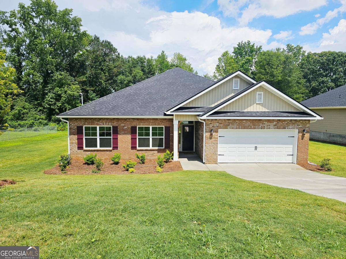 Welcome to "The Horizon Retreat" - A Stunning 2316 SQ FT 4BD/3BA Ranch in Scarlett Place! This Ranch Style home features an open-concept living area, granite countertops with tile backsplash, main-level master suite with separate tub & shower, and a versatile upstairs rec room. Standard features include full sod front & back, 30-year shingles, brick-front exterior, 51/4 baseboards (even in the garage), tray ceiling in master, garbage disposal, and more. Covered patio perfect for relaxing outdoors. No HOA, USDA eligible, only $1,000 earnest money! **Price Reflects Builder Incentive**