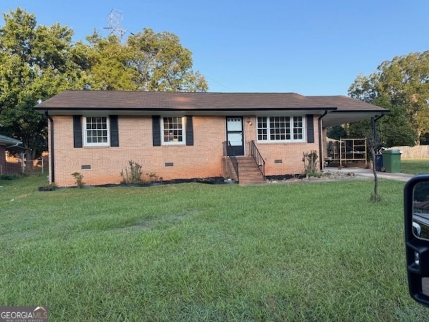 Adorable 3 bedroom / 1 bath home is ready for it's new tenants.  This home has recently been painted throughout.  The three bedrooms are nice in size.  Entrance through the carport goes into the kitchen which is  open to the dining room.  Large backyard with detached garage.  New landscaping, shutters and more.  Call today to schedule a walk through.