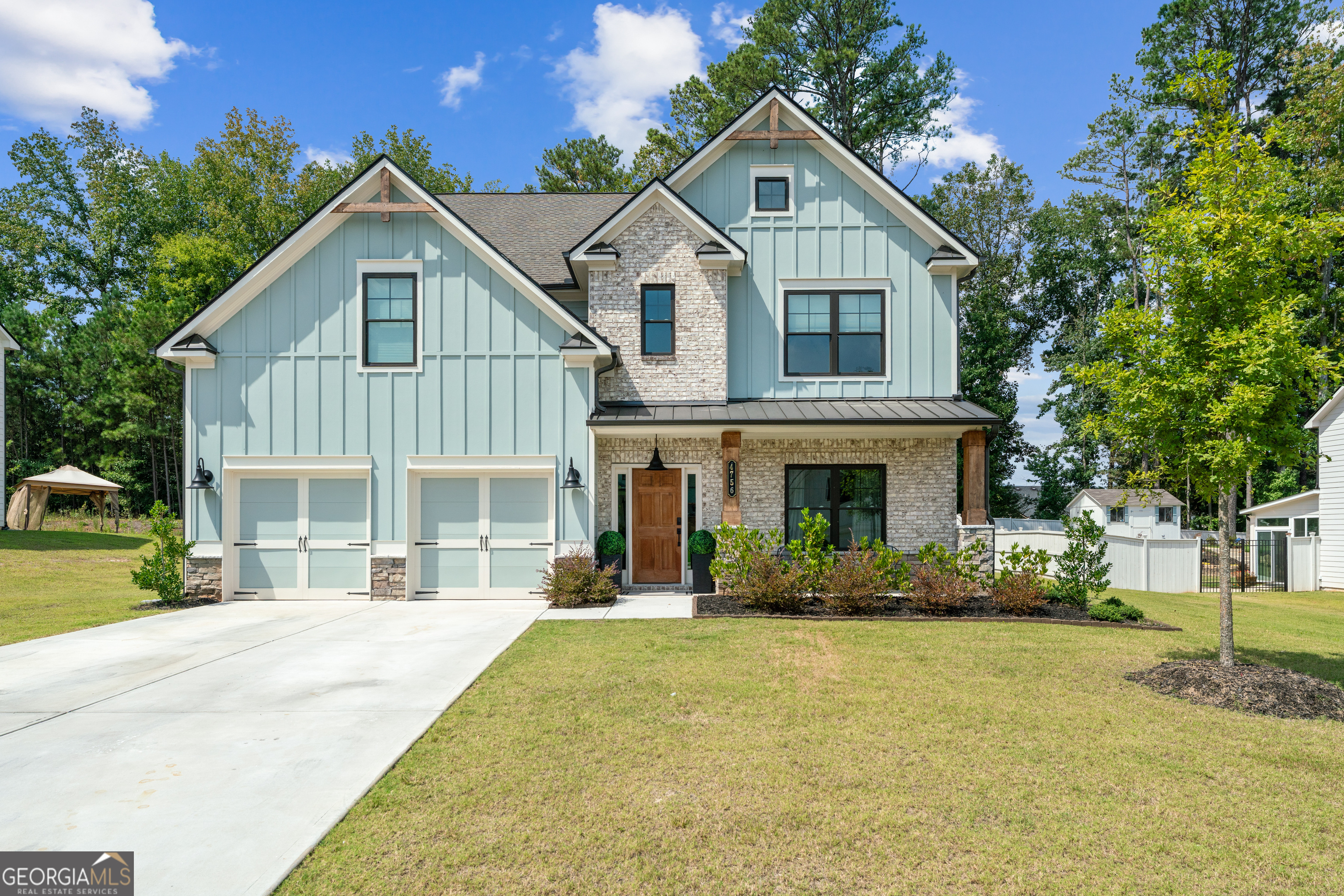 ABSOLUTELY STUNNING AND BETTER THAN NEW!!! Built in 2023 and recently upgraded with thoughtful finishes, this 4-bedroom, 3.5-bathroom home offers 3,226 square feet of modern living. The owner has added tasteful updates throughout, creating a home that feels fresh, inviting, and move-in ready. Step inside to find brand new flooring, fully remodeled bathrooms, and updated details throughout the interior. The spacious living room is anchored by a fireplace, and the open flow makes the home ideal for both gatherings and everyday life. The master suite is a true retreat, offering a spacious bedroom and a luxurious en-suite bathroom with a double vanity. Another upstairs bedroom also includes a double vanity, making it perfect for guests or family. Every bathroom in the home is brand new, showcasing elegant design and quality workmanship. This home will be sold fully furnished, making your move simple and seamless. The remodels were completed with great attention to detail, ensuring both style and durability. The level backyard includes a covered patio, a custom gazebo, and a built-in fire pit-perfect for entertaining or relaxing outdoors. A two-car garage and leveled driveway add convenience and plenty of parking. Located in a quiet subdivision and served by great Cobb County Schools, this home offers the perfect balance of comfort, style, and convenience. With its combination of new construction, tasteful upgrades, and fully furnished interiors, this home combines modern upgrades with move-in-ready ease.