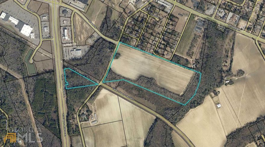 Great parcel of land located near the walking trail and town. 44 acres of prime residential property currently zoned R-25. City water and sewer is available. Call today!