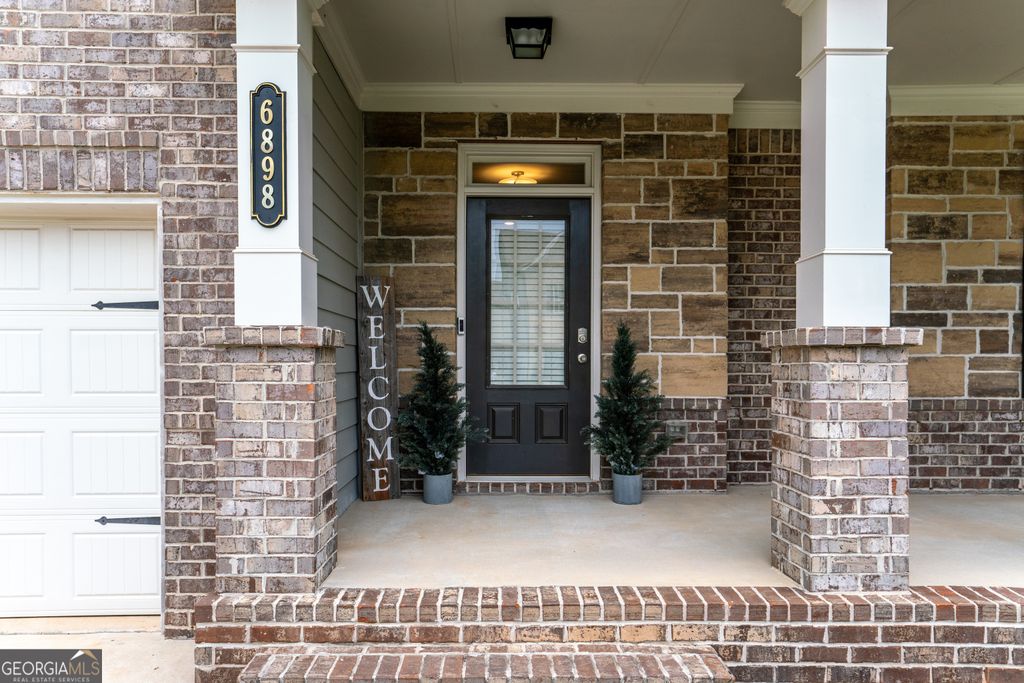 Photo of 6898 Lancaster Crossing, Flowery Branch, GA 30542 (MLS # 10658036)