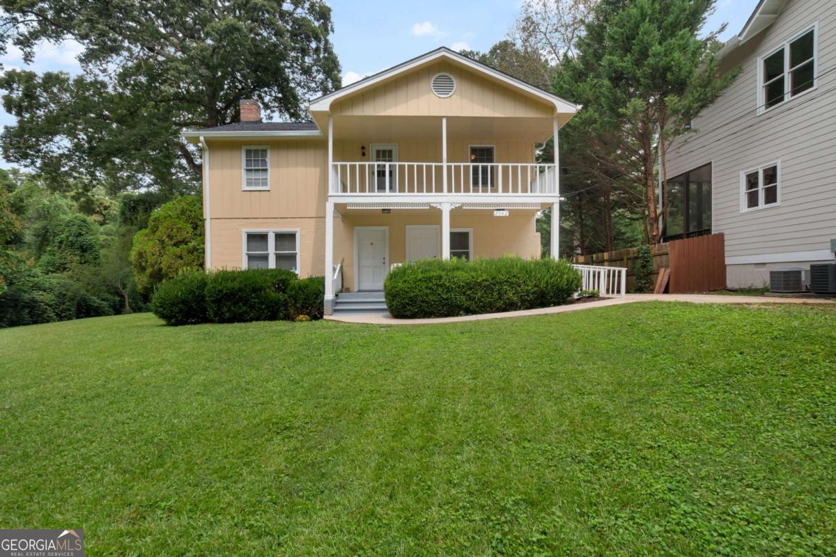 Welcome to this spacious 5-bedroom, 2-bath home, perfectly designed for comfort, flexibility, and privacy. Set on a 0.55-acre tree-lined lot, this home offers a peaceful retreat just minutes from shops, dining, and parks. Inside, you'll love the gleaming hardwood floors throughout, a bright living area with a cozy fireplace, and a stylish kitchen featuring stainless steel appliances and plenty of storage. The layout provides five generously sized bedrooms, ideal for families, roommates, or anyone needing extra space for a home office or guest room. Step outside to enjoy the expansive yard - perfect for gatherings, gardening, or simply relaxing in your private outdoor oasis. The covered balcony and inviting front porch add even more charm and usable space for unwinding. This home offers the space you need, the upgrades you want, and the privacy you'll love. Schedule your showing today and make it your next home!