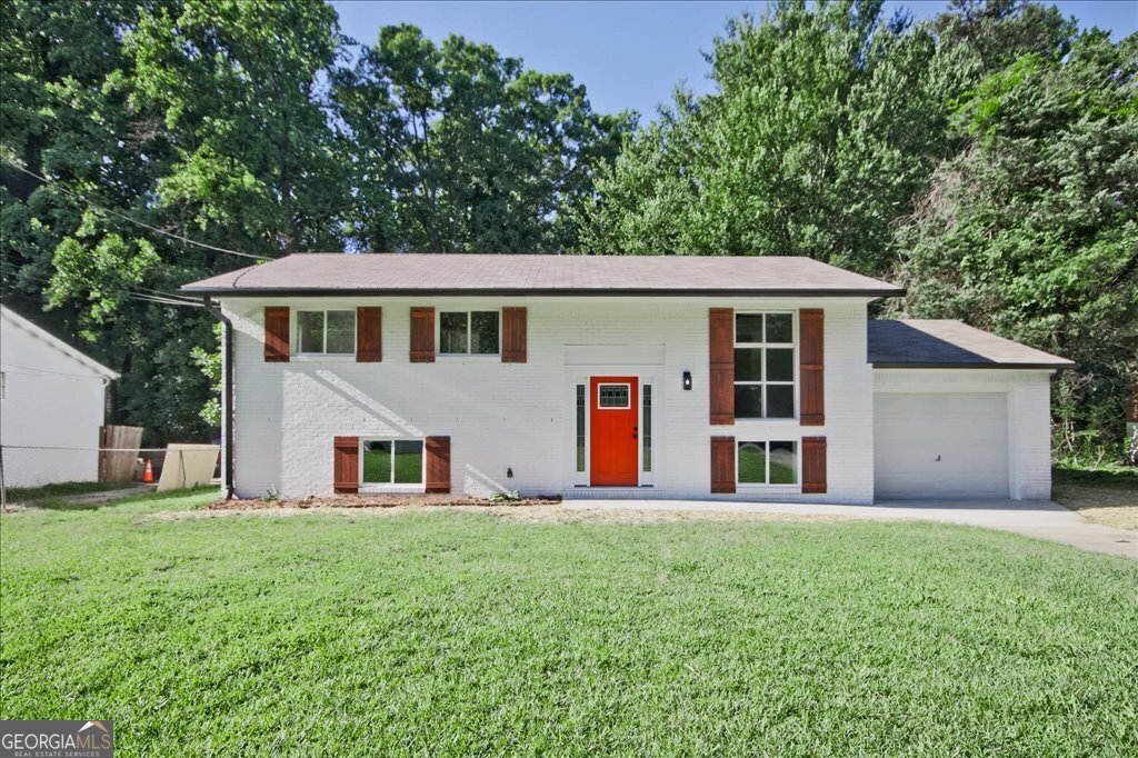 Welcome to 1349 Heather Circle-a captivating all-brick residence that seamlessly blends elegance with everyday comfort. This beautifully designed 4-bedroom, 2-bathroom home is now on the market, providing the perfect sanctuary for buyers in search of both space and style. Step inside and experience an interior bathed in natural sunlight, thanks to expansive windows that create a bright and welcoming ambiance. The thoughtfully designed open-concept layout effortlessly connects the living room, dining area, and kitchen, making it ideal for hosting gatherings or enjoying quiet family moments. At the heart of the home is a modern kitchen adorned with luxurious stone countertops, delivering both functionality and refined charm-a dream space for culinary enthusiasts. Each bedroom offers generous proportions, ensuring restful privacy, while the bathrooms feature Italian-style tilework that exudes spa-like sophistication, elevating your daily routine. A spacious garage provides secure and easy parking. The deck overlooks the vast backyard and serves as a private retreat for outdoor enjoyment. Whether you're planning summer cookouts or looking for a peaceful space to relax, this lush green expanse is your personal slice of paradise.