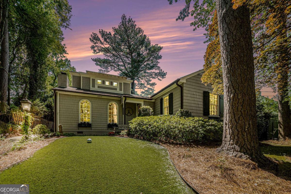 Welcome to Morningside at its very best! This move-in ready home perfectly blends clean, modern lines with timeless style and comfort. The heart of the home is a gourmet, top-of-the-line kitchen and great room combination that overlooks a private garden, creating seamless indoor-outdoor living. Sitting on a tranquil perch, the home enjoys an abundance of natural light and privacy, with multiple outdoor terrace areas perfect for relaxing or entertaining. A charming living room with a fireplace opens beautifully to the great room and kitchen. The main level features three spacious guest bedrooms with ample closet space and a separate dedicated home office. The second floor is an outstanding master suite, complete with walk-in closets, a beautiful spa-like bathroom with a soaking tub, and a private outdoor terrace. This home is designed for easy living, with an astroturf front lawn that requires no upkeep. A power gate secures the rear motor court, which includes a one-car garage and a newly expanded parking area. Enjoy the ultimate convenience of living with close proximity to Morningside Elementary, as well as the neighborhood's shops and restaurants.