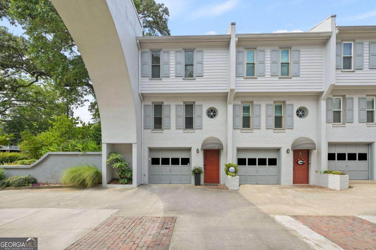 This welcoming, well-lit, end unit townhome is situated on a quiet section of street in the highly desirable neighborhood of Virginia Highland. The spacious living experience of the main living room provides an inviting space for relaxation and entertainment. The warm updated eat-in kitchen is ideal for home cooking and opens to the outdoor fenced patio/yard to expand the living space and grilling opportunities. The two bedrooms on the upper level provide a private escape, perfect for restful nights. The townhome also includes a GARAGE which is excellent for parking as well as additional storage space or the possibility of adding another room. There is always available parking in the rear of the complex also. This home is in a prime location within close walking distance to Ponce City Market, the Beltline, and all of Virginia HighlandCOs shops and restaurants. Low monthly HOA payments include cable and internet.