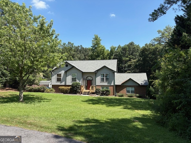 What a great opportunity! This home has been meticulously cared for and offers lots of room on a private lot at the end of a cul de sac. Features include an excetionally roomy in-law suite along with up to date finishes including a separate bedroom, full bath and large entertainment space with kitchen. An additional storage shed along and large roomy shop provide additional storage space. Drive under garage (704 sq ft including garage and shop area) comes equiped with amazing storage cabinets and shelving. Rear deck and patio are perfect for entertaining with direct access to roomy kitchen and great room. This home also offers a large, cleared back yard to use for gardening or maybe installing your own in ground pool. On a hard to find large (.96 acres) lot, you can install your own private garden or just enjoy the many visitors provided by mother nature. This is a private oasis located in the heart of Snellvile, convenient to shopping, entertainment, recreation, education, and transportation.