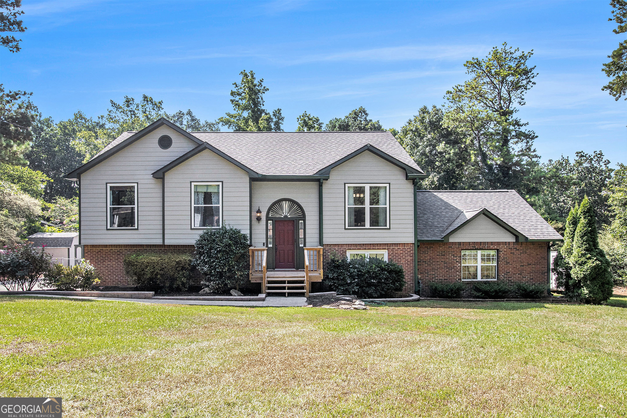 What a great opportunity! This home has been meticulously cared for and offers lots of room on a private lot at the end of a cul de sac. Features include an excetionally roomy in-law suite along with up to date finishes including a separate bedroom, full bath and large entertainment space with kitchen. An additional storage shed along and large roomy shop provide additional storage space. Drive under garage (704 sq ft including garage and shop area) comes equiped with amazing storage cabinets and shelving. Rear deck and patio are perfect for entertaining with direct access to roomy kitchen and great room. This home also offers a large, cleared back yard to use for gardening or maybe installing your own in ground pool. On a hard to find large (.96 acres) lot, you can install your own private garden or just enjoy the many visitors provided by mother nature. This is a private oasis located in the heart of Snellvile, convenient to shopping, entertainment, recreation, education, and transportation.