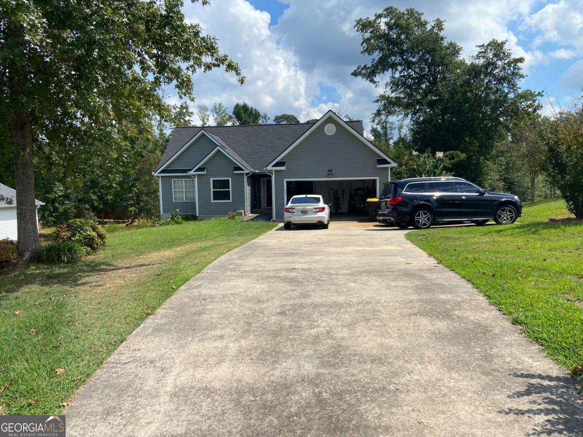 This well-loved home is in great condition and located in a wonderful neighborhood. It features hardwood and LVP flooring throughout, plus a nice walkout basement with plenty of room for recreation. Downstairs you'll also find a full bathroom with a relaxing jet tub. A perfect blend of comfort, charm, and space, this home is move-in ready!