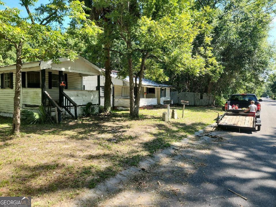 Three Homes on a huge corner Lot, one of which is a Duplex.....Close to all. These homes will all need a full rehab but it's a great investment.
